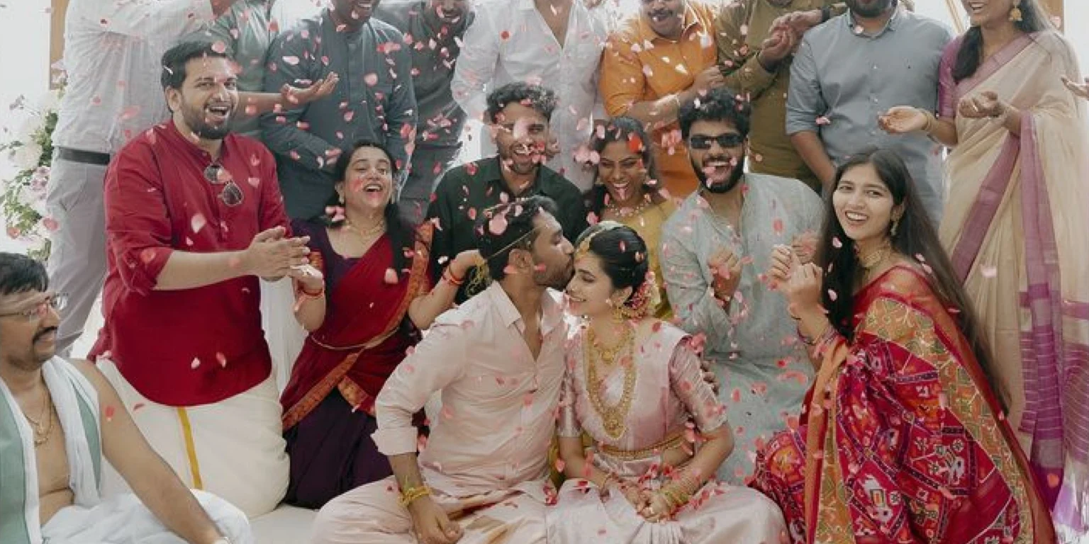 Family showering couple with petals